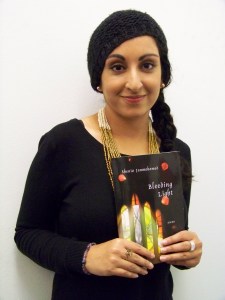 Sheniz Janmohamed holding her book