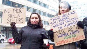 Native Woman and ally at rally 2013