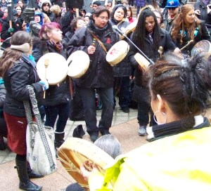Native Women drumming at rally 2013