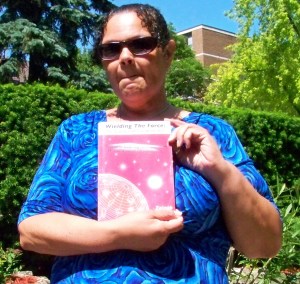 Zainab holding her book