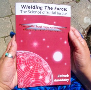 Zainabs hands holding book