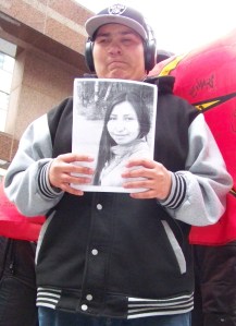 Young Jibwe holding photo